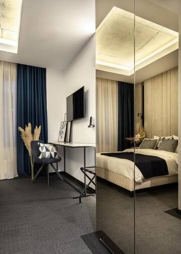 Фото номера Двухместный номер Делюкс с 1 кроватью Отель Union Plaza Hotel г. Бухарест 10