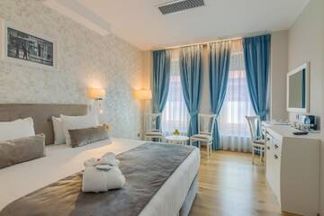 Фото номера Улучшенный номер Делюкс Отель New Era Hotel г. Бухарест 5