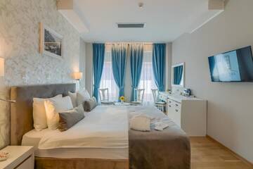 Фото номера Улучшенный номер Делюкс Отель New Era Hotel г. Бухарест 20
