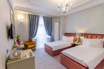 Фото номера Двухместный номер Делюкс с 2 отдельными кроватями Отель Hotel Lido by Phoenicia г. Бухарест 3