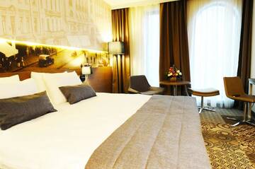 Фото номера Номер категории Privilege с кроватью размера &quot;king-size&quot; Отель Mercure Bucharest City Center г. Бухарест 6