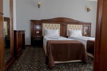 Фото номера Стандартный двухместный номер с 2 отдельными кроватями Отель Hotel Giuliano г. Бухарест 3