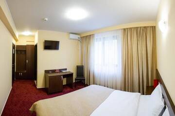 Фото номера Двухместный номер Делюкс с 1 кроватью Отель Hotel Athos г. Бухарест 29