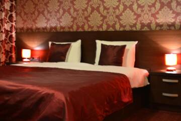 Фото номера Двухместный номер Делюкс с 1 кроватью Отель Hotel Athos г. Бухарест 6