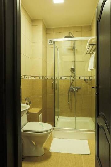 Фото номера Двухместный номер Делюкс с 1 кроватью Отель Hotel Athos г. Бухарест 13
