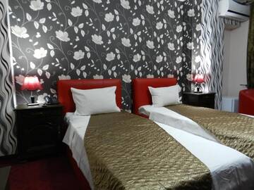 Фото номера Двухместный номер с 2 отдельными кроватями Отель Hotel Marinii г. Бухарест 4