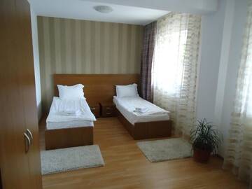 Фото номера Двухместный номер с 2 отдельными кроватями Отель Hotel Nova Residence г. Бухарест 12