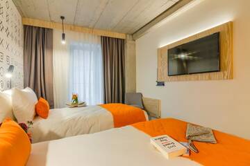 Фото номера Стандартный двухместный номер с 2 отдельными кроватями Отель ibis Styles Bucharest City Center г. Бухарест 9