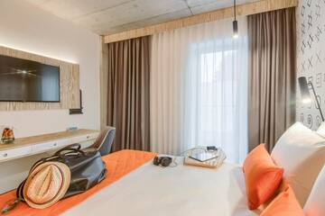 Фото номера Стандартный двухместный номер с 1 кроватью Отель ibis Styles Bucharest City Center г. Бухарест 11