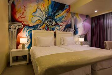 Фото номера Двухместный номер с 2 отдельными кроватями Отель Ganzo Boutique Hotel г. Бухарест 9