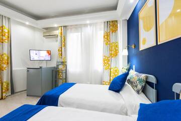 Фото номера Двухместный номер с 2 отдельными кроватями Отель Relax Comfort Suites Hotel г. Бухарест 2