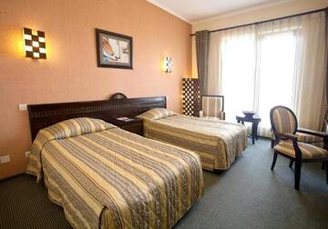 Фото номера Двухместный номер с 2 отдельными кроватями Отель Hotel Tecadra г. Бухарест 2