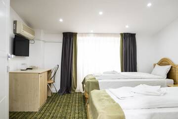 Фото номера Стандартный двухместный номер с 2 отдельными кроватями Отель Casa Gabriela г. Бухарест 4