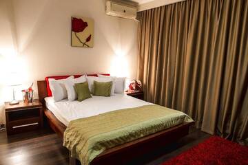 Фото номера Апартаменты с 2 спальнями Отель Phoenicia Suites Baneasa г. Бухарест 3