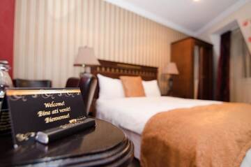Фото номера Стандартный двухместный номер с 1 кроватью Отель Hotel Boutique Monaco г. Бухарест 15