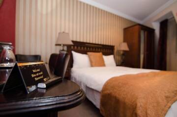Фото номера Улучшенный двухместный номер с 1 кроватью Отель Hotel Boutique Monaco г. Бухарест 8