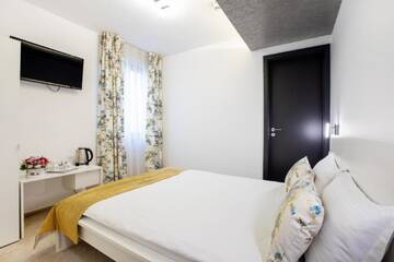 Фото номера Апартаменты с 2 спальнями Отель Hotel Duke Romana г. Бухарест 3