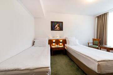 Фото номера Двухместный номер эконом-класса с 2 отдельными кроватями Отель Hotel Duke Romana г. Бухарест 11