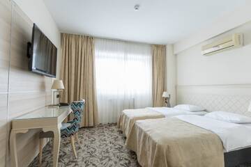 Фото номера Стандартный двухместный номер с 2 отдельными кроватями Отель Siqua Hotel г. Бухарест 4