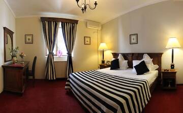 Фото номера Стандартный двухместный номер с 1 кроватью Отель Arc de Triomphe by Residence Hotels г. Бухарест 2