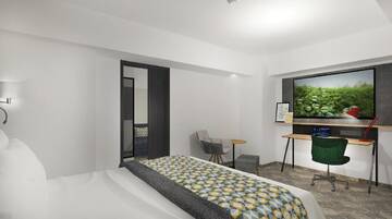 Фото номера Люкс с кроватью размера &quot;king-size&quot; и гостиной Отель Holiday Inn Bucharest - Times г. Бухарест 3