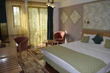Фото номера Улучшенный двухместный номер с 1 кроватью Отель Hotel Michelangelo г. Бухарест 5