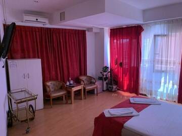 Фото номера Двухместный номер Делюкс с 1 кроватью Отель Hotel Funnytime г. Бухарест 10