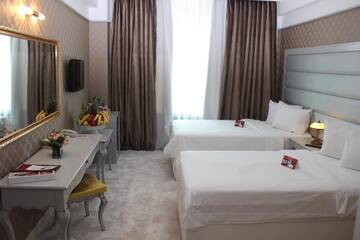 Фото номера Двухместный номер «Премиум» с 2 отдельными кроватями Отель Phoenicia Grand Hotel г. Бухарест 4