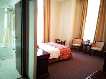 Фото номера Стандартный двухместный номер с 1 кроватью Отель Atrium Hotel Ateneu City Center г. Бухарест 7