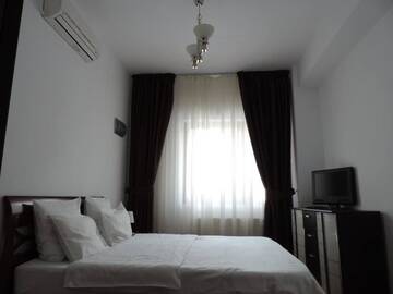 Фото номера Апартаменты с 2 спальнями и балконом (4 взрослых) Отель Monte Carlo Palace Suites г. Бухарест 3