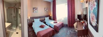 Фото номера Стандартный двухместный номер с 2 отдельными кроватями Отель RIN Central Hotel г. Бухарест 20
