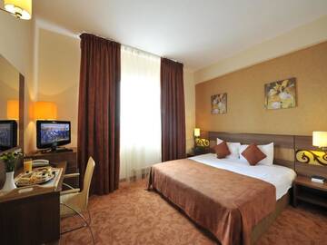 Фото номера Стандартный двухместный номер с 2 отдельными кроватями Отель RIN Central Hotel г. Бухарест 10