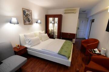 Фото номера Стандартный двухместный номер с 1 кроватью Отель Atrium Hotel Bucharest City Center г. Бухарест 8