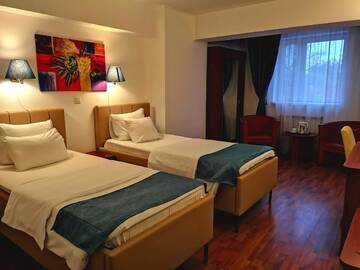 Фото номера Стандартный двухместный номер с 2 отдельными кроватями Отель Atrium Hotel Bucharest City Center г. Бухарест 6