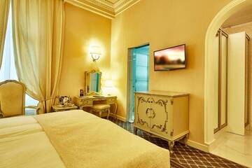 Фото номера Улучшенный двухместный номер с 1 кроватью Отель Grand Hotel Continental г. Бухарест 7