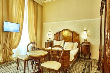 Фото номера Двухместный номер Делюкс с 1 кроватью Отель Grand Hotel Continental г. Бухарест 2