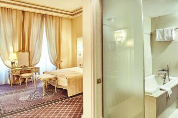 Фото номера Двухместный номер Делюкс с 1 кроватью Отель Grand Hotel Continental г. Бухарест 7