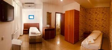 Фото номера Двухместный номер с 2 отдельными кроватями Отель Liad Hotel г. Бухарест 4